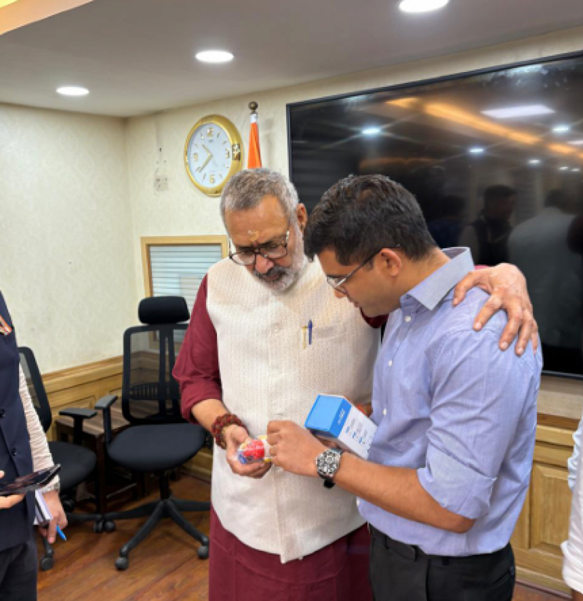 DJ Goel with a partner inspecting a Verra product.
