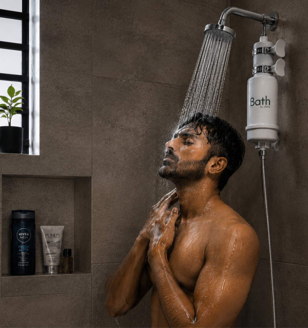 A man showering under a Bath by Verra filter.